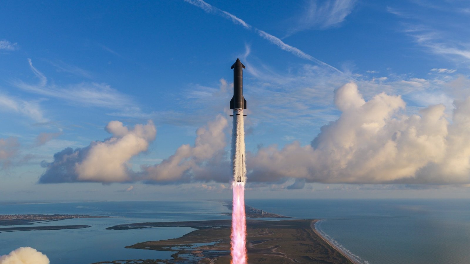 Starship climbing away from the coast on its first orbital flight, Sept. 28
