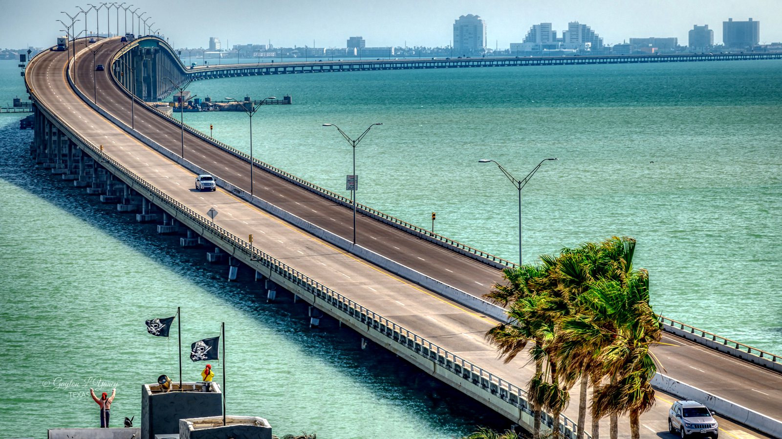 The Queen Isabella Causeway curving over the Laguna Madre toward South Padre Island's skyline