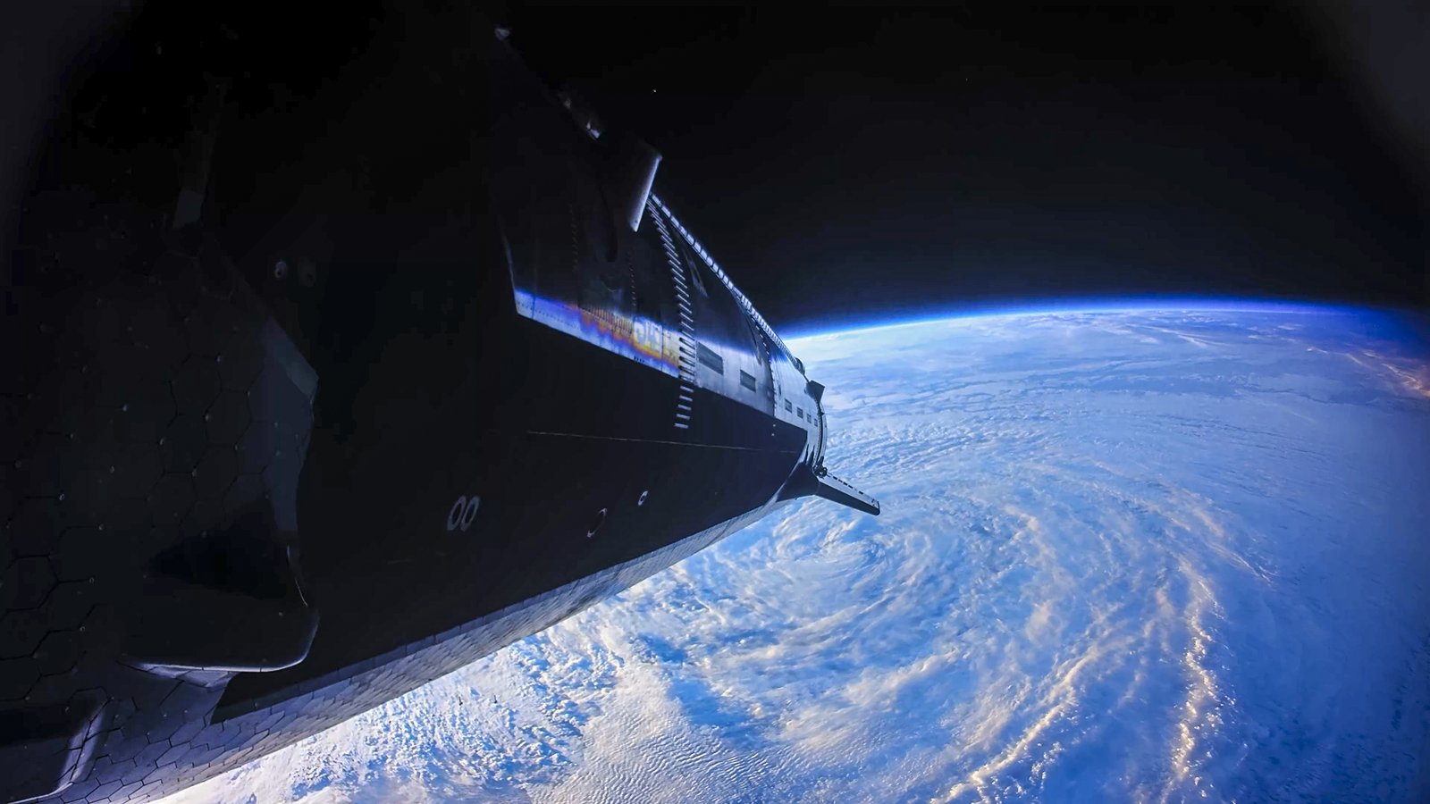 The hull of Ship 41 against the curve of the Earth, seen from an onboard camera during Flight 14